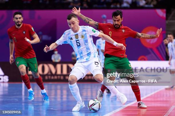 Maximiliano Rescia of Argentina is challenged by Joao Matos of Portugal during the FIFA Futsal World Cup 2021 Final match between Argentina and...