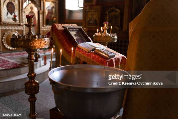orthodox baptism, font and candles - godmother stock pictures, royalty-free photos & images