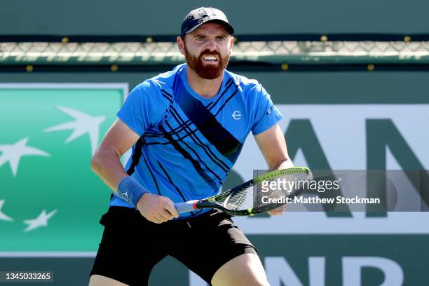 Bjorn Fratangelo plays Mikael Torpegaard of Denmark during qualifying for the BNP Paribas Open at the Indian Wells Tennis Garden on October 05, 2021...