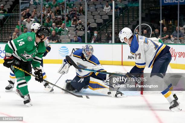 Jordan Binnington of the St. Louis Blues blocks a shot on goal against Jamie Benn of the Dallas Stars in the first period of a preseason NHL game at...