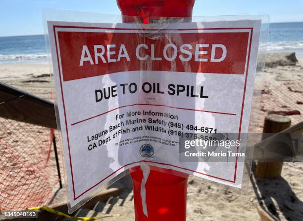 Sign reads 'Area Closed Due To Oil Spill' after a 126,000-gallon oil spill from an offshore oil platform on October 5, 2021 in Laguna Beach,...