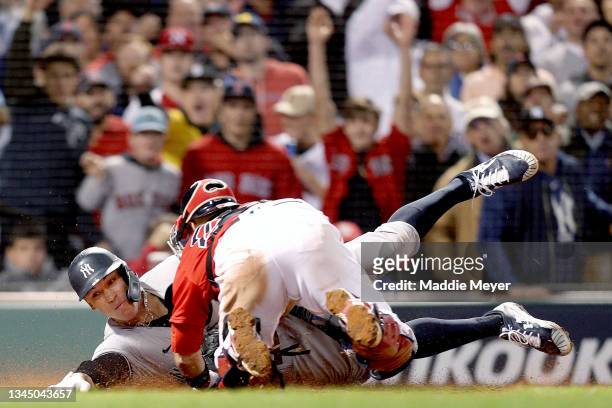 Aaron Judge of the New York Yankees is tagged out by Kevin Plawecki of the Boston Red Sox during the sixth inning of the American League Wild Card...
