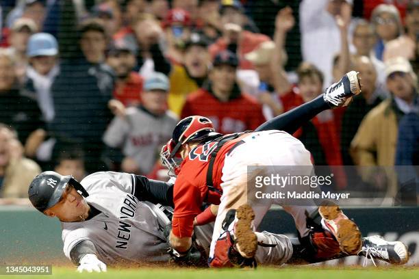 Aaron Judge of the New York Yankees is tagged out by Kevin Plawecki of the Boston Red Sox during the sixth inning of the American League Wild Card...