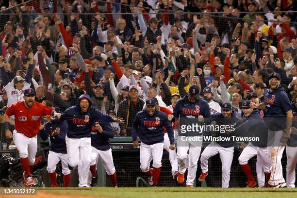 The Boston Red Sox celebrate after beating the New York Yankees 6-2 in the American League Wild Card game at Fenway Park on October 05, 2021 in...