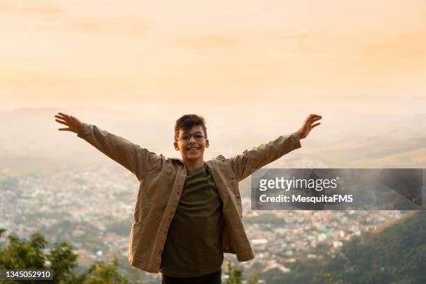 child with open arms on the mountain - open day 11 stock pictures, royalty-free photos & images