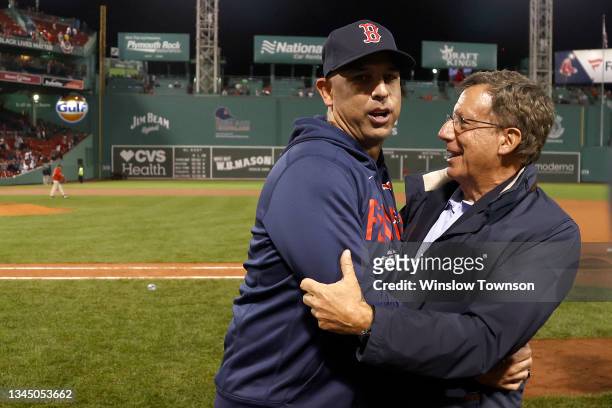 Manager Alex Cora reacts with Tom Werner, chairman of the Boston Red Sox, after beating the New York Yankees 6-2 in the American League Wild Card...