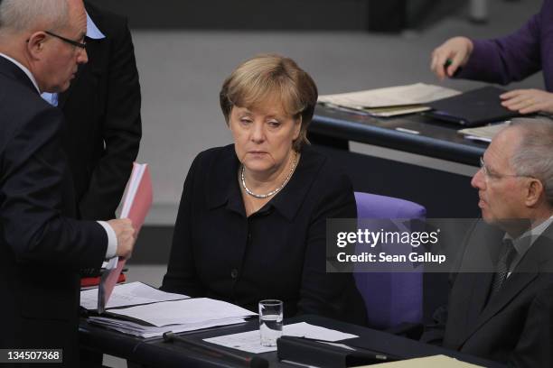 German Chancellor Angela Merkel , Finance Minister Wolfgang Schaeuble and Volker Kauder, head of the Bundestag faction of the German Christian...