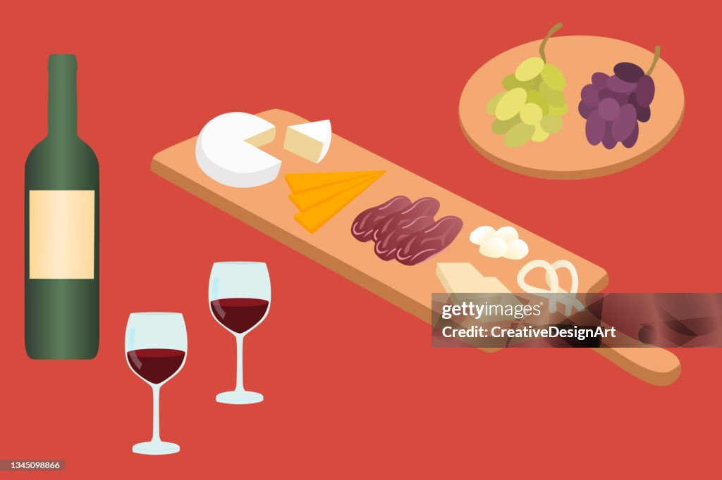 Grapes And Various Cheeses On Wooden Cheese Board With Wine Bottle And Wine Glasses
