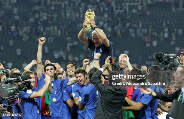 Marcello Lippi head coach of Italy and his players celebrate with the trophy at the end the World Cup 2006 final football game Italy and France, 09...