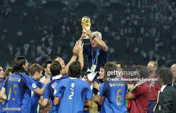 Marcello Lippi head coach of Italy and his players celebrate with the trophy at the end the World Cup 2006 final football game Italy and France, 09...