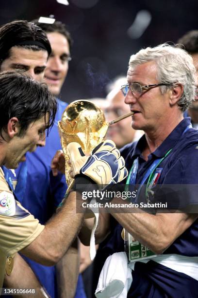 Marcello Lippi head coach of Italy and Ginaluigi Buffon celebrates the victory with the trophy at the end the World Cup 2006 final football game...