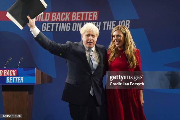 Carrie Johnson greets her husband Boris Johnson following his leader's keynote speech during the Conservative Party conference at Manchester Central...