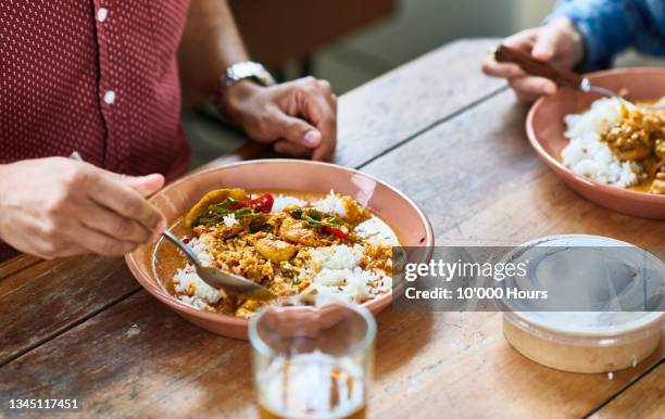 close up of curry on plate with rice - rice stock pictures, royalty-free photos & images