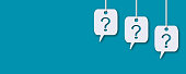 Question marks with speech bubbles on a blue background.