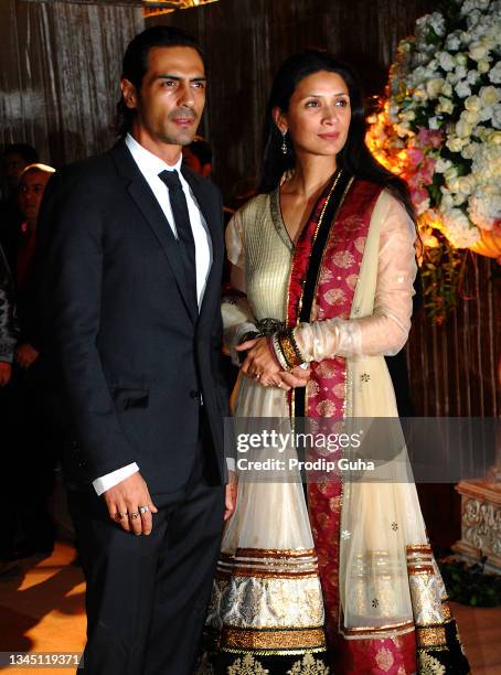 Arjun Rampal and Mehr Jesia attend the wedding reception of Dhiraj Deshmukh and Deepshikha Bhagnani on February 28, 2012 in Mumbai, India.