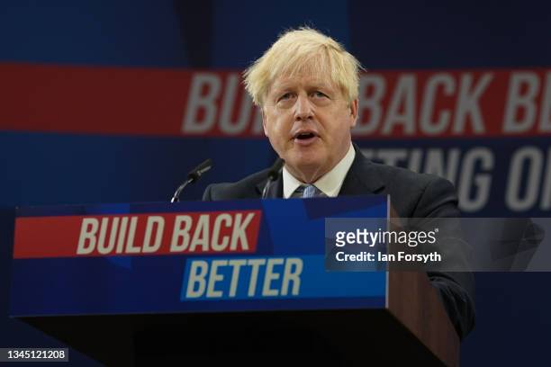 Britain's Prime Minister Boris Johnson delivers his leader's keynote speech during the Conservative Party conference at Manchester Central Convention...