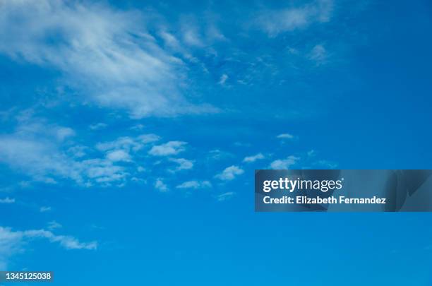 white clouds on blue sky. cirrus fibratus and cirrocumulus clouds. - 巻積雲 ストックフォトと画像