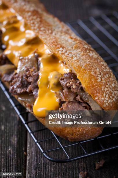 a philly steak sandwich - cheese sauce stock pictures, royalty-free photos & images