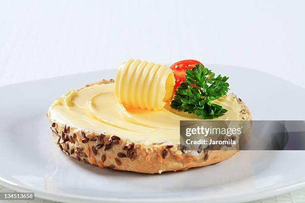 bread roll and butter - butter curl stock pictures, royalty-free photos & images