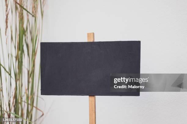 close-up blackboard in front of a wall. decoration service at a garden party, summer festival, or wedding. catering. - up front party stock pictures, royalty-free photos & images