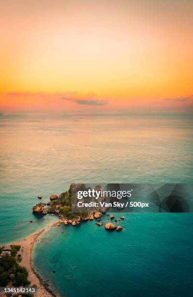 high angle view of sea against sky during sunset,taormina,province of messina,italy - taormina stock pictures, royalty-free photos & images