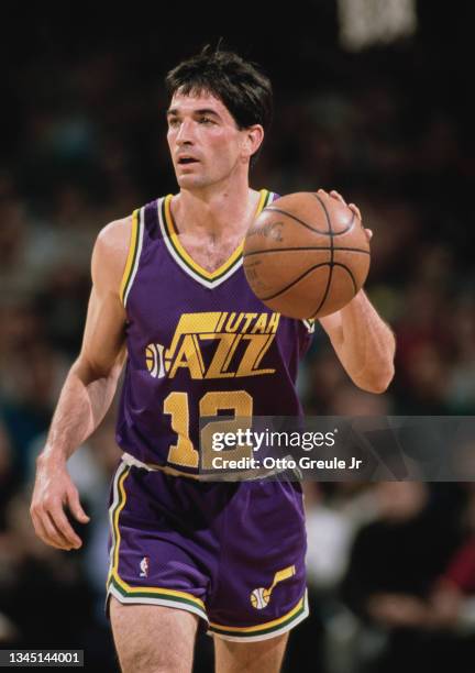 John Stockton, Point Guard for the Utah Jazz dribbles the basketball down court during the NBA Pacific Division basketball game against the Portland...