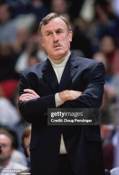 Rick Adelman, Head Coach for the Sacramento Kings folds his arms and looks on during the NBA Atlantic Division basketball game against the Washington...