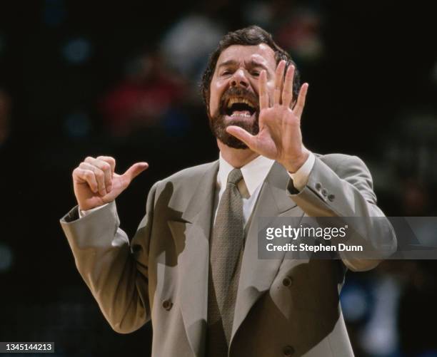 Carlesimo, Head Coach for the Portland Trail Blazers makes hand signals to his players during the NBA Midwest Division basketball game against the...