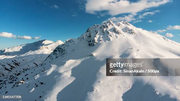 scenic view of snowcapped mountains against sky,antalya,turkey - ski hut stock pictures, royalty-free photos & images