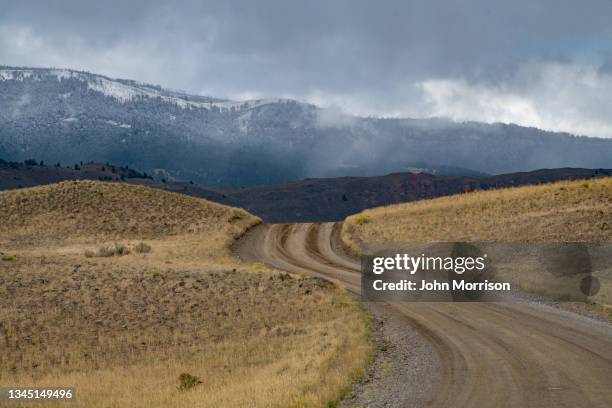 old yellowstone trail road after storm - khaki stock pictures, royalty-free photos & images