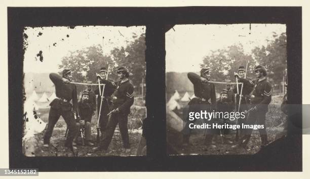 Untitled [American soldiers posing with weapons], 1850-1900. [Note black soldier in the background]. Albumen print, stereocard, possibly by Mathew...