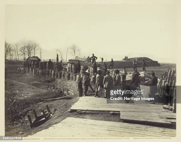 Fortifications at Manassas, March 1862. [Scene from the American Civil War, soldiers with barrels filled with earth]. Albumen print, pl. 11 from the...
