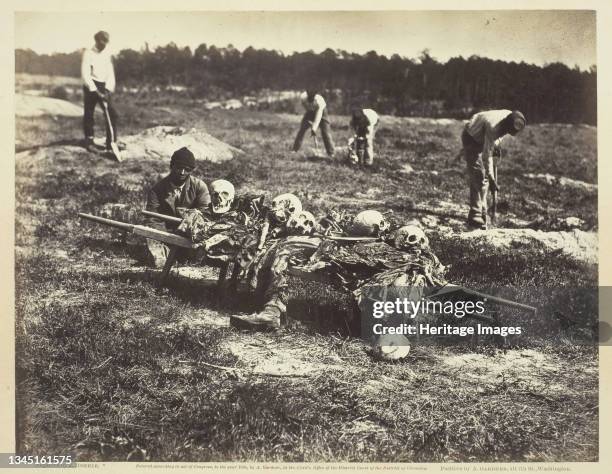Burial Party, Cold Harbor, Virginia, April 1865. [Scene from the American Civil War: gravediggers bury the remains of soldiers killed in battle]....