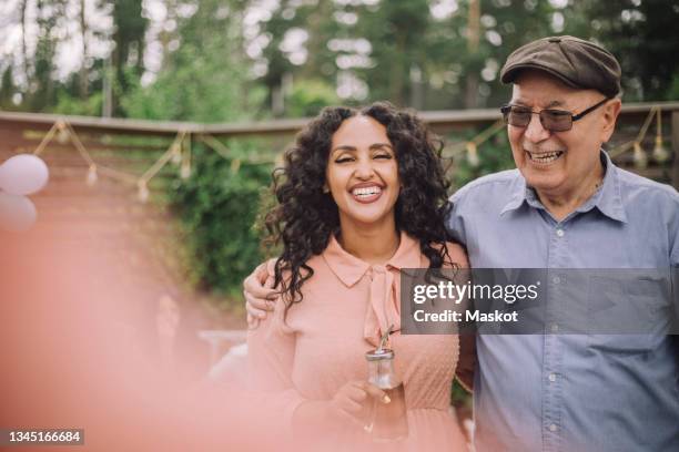 happy father and daughter in birthday party - father and grown up daughter stockfoto's en -beelden