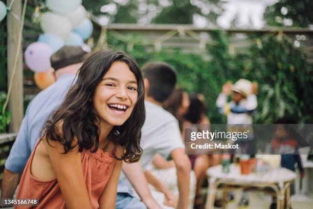 portrait of smiling girl in birthday party - tweenies stockfoto's en -beelden