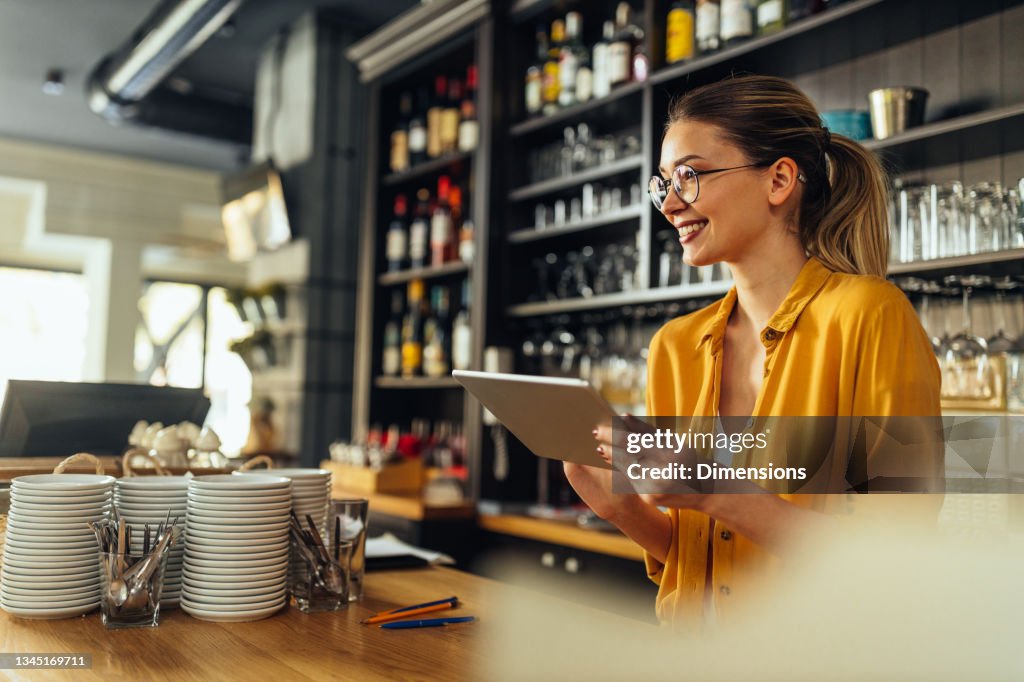 Waitress checking out the newest coffee trends online
