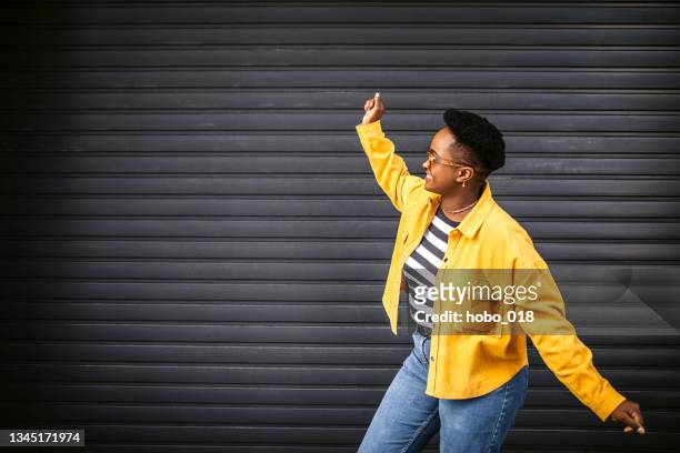 young black cute woman dancing on the street - dance challenge stock pictures, royalty-free photos & images