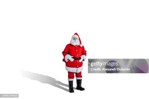 surprised santa claus with bag on white background isolate. christmas advertising and sale concept - affiche spectacle stockfoto's en -beelden