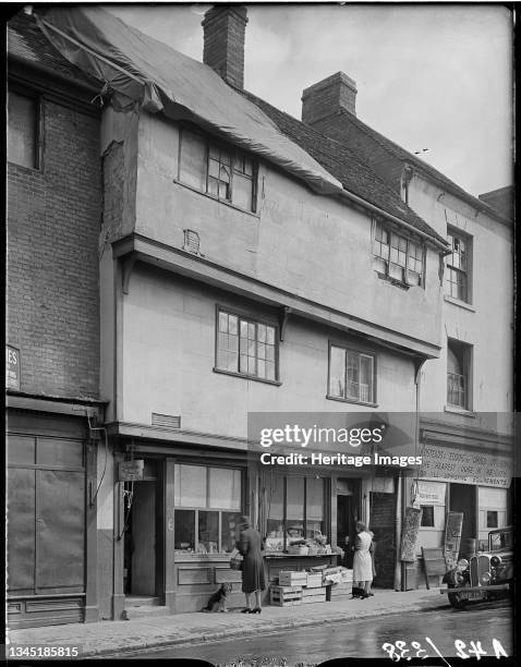 Gosford Street, Coventry, Coventry, Coventry, 1941. The exterior of shop premises at 6 and 7 Gosford Street showing foodstuffs displayed outside...