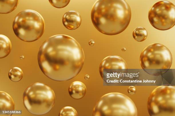 abstract group of geometric golden spheres background - sphere stock pictures, royalty-free photos & images