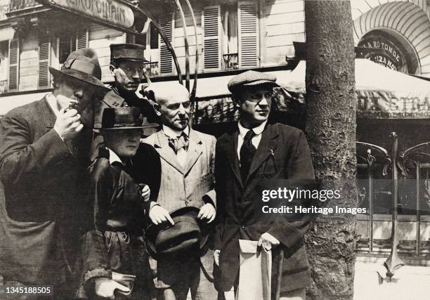 Jean Cocteau, Manuel Ortiz de Zárate, Henri-Pierre Roché, Marie Vassilieff, Max Jacob and Picasso. Montparnasse, La Rotonde, 1916. Private...