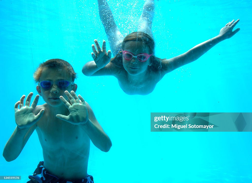 Child and girl underwater