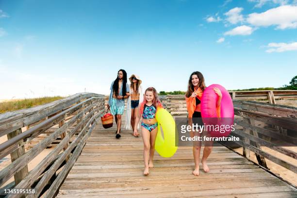 family arriving at the beach - virginia beach stock pictures, royalty-free photos & images