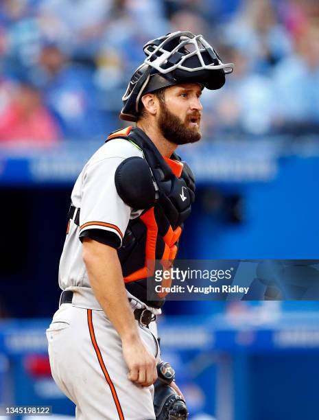 Nick Ciuffo of the Baltimore Orioles catches during a MLB game against the Toronto Blue Jays at Rogers Centre on October 2, 2021 in Toronto, Ontario,...