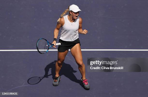 Yulia Putintseva of Kazakhstan celebrates a point against Andrea Petkovic of Germany during their first round match on Day 3 of the BNP Paribas Open...