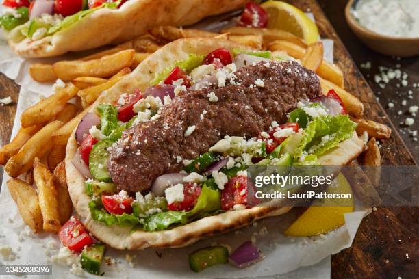beef kofta pita wrap with french fries - greek tzatziki stock pictures, royalty-free photos & images