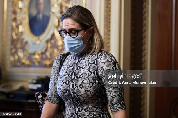 Sen. Kyrsten Sinema departs from a caucus meeting with Democratic Senators after a procedural vote on the debt limit was postponed at the U.S....