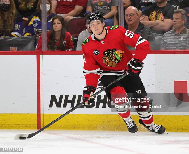 Ian Mitchell of the Chicago Blackhawks looks to pass against the St. Louis Blues during a preseason game at the United Center on October 01, 2021 in...