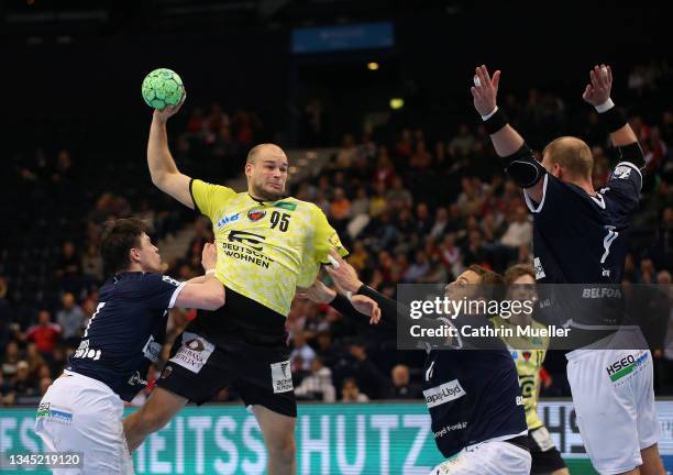 Paul Drux of Fuechse Berlin is challenged by Leif Tissier , Lukas Ossenkopp and Manuel Spaeth of Handball Sport Verein Hamburg during the DHB-Pokal...