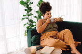 Healthy woman having coffee at home